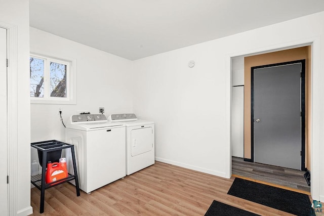 733 13th Ave, Two Harbors, MN 55616 - laundry area featuring washer and dryer, light wood-type flooring, and baseboards