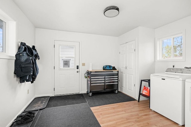 733 13th Ave, Two Harbors, MN 55616 - washroom with washing machine and clothes dryer, wood finished floors, and baseboards