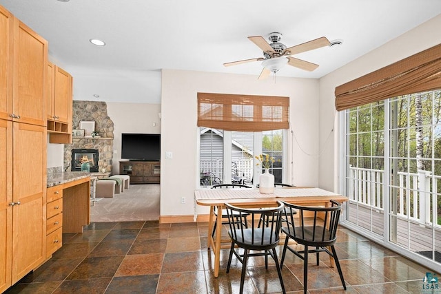 203 S 2nd Ave, Proctor, MN 55810 - dining area featuring a fireplace, ceiling fan, recessed lighting, and baseboards