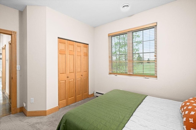 203 S 2nd Ave, Proctor, MN 55810 - bedroom with carpet, a baseboard radiator, baseboards, and a closet