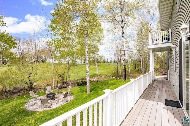 203 S 2nd Ave, Proctor, MN 55810 - deck with a fire pit, a lawn, and a patio