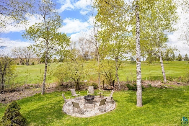 203 S 2nd Ave, Proctor, MN 55810 - view of green lawn with an outdoor fire pit