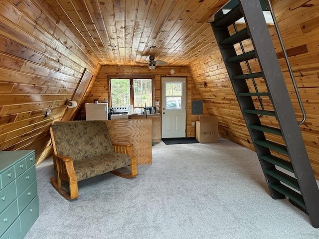 1473 S Kane Lake Rd, Two Harbors, MN 55616 - living area with wooden walls, light colored carpet, ceiling fan, and wooden ceiling