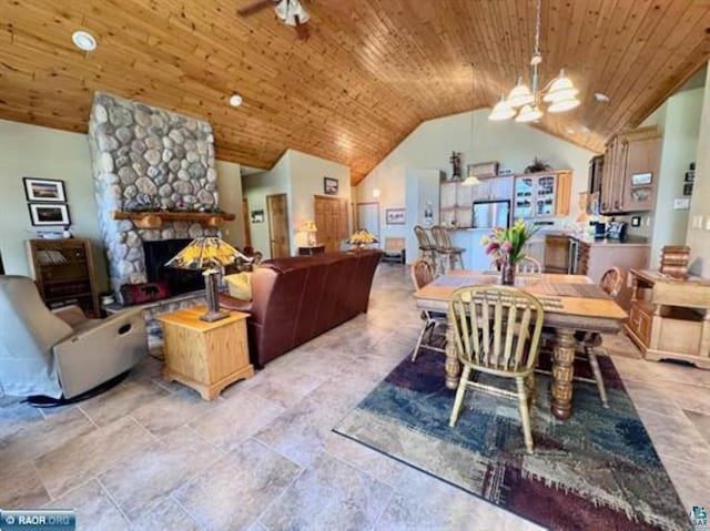 3622 Wildgate Rd, Ely, MN 55731 - dining space featuring wooden ceiling, lofted ceiling, a chandelier, and a stone fireplace