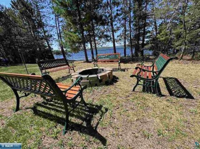 3622 Wildgate Rd, Ely, MN 55731 - view of property's community featuring an outdoor fire pit, a water view, and a lawn