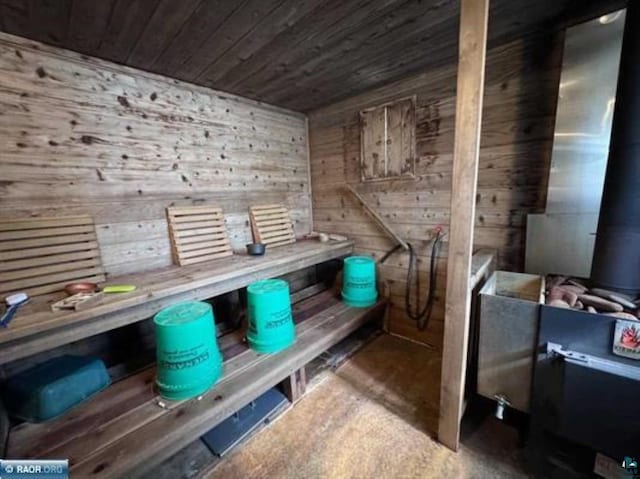 3622 Wildgate Rd, Ely, MN 55731 - sauna featuring wood ceiling, wood walls, and concrete flooring