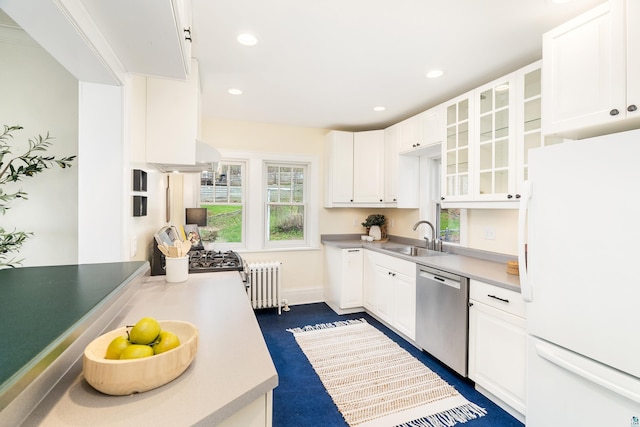 1203 E 11th St, Duluth, MN 55805 - kitchen with freestanding refrigerator, dishwasher, a sink, radiator heating unit, and white cabinets