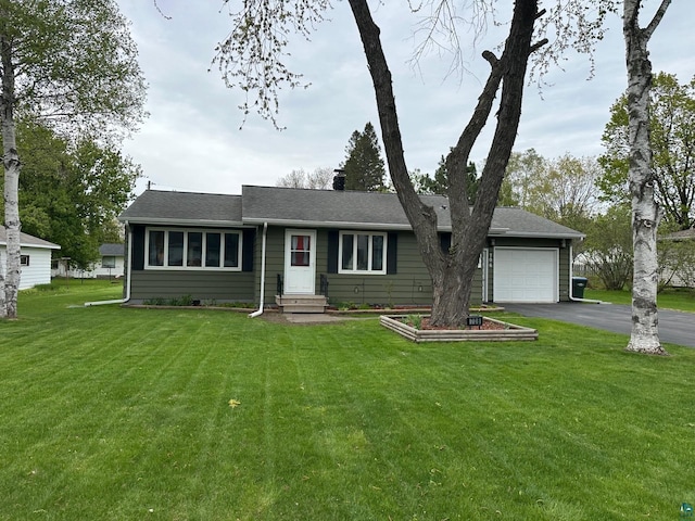 706 28th St, Cloquet, MN 55720 - ranch-style house with driveway, entry steps, a chimney, an attached garage, and a front yard