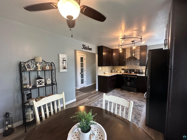 706 28th St, Cloquet, MN 55720 - dining space featuring baseboards, a ceiling fan, and light wood-style flooring