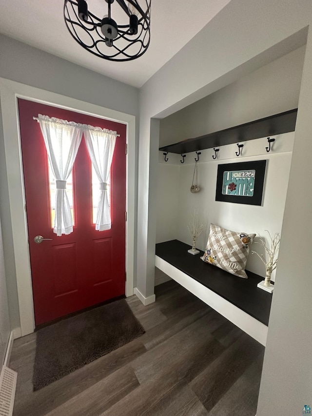 706 28th St, Cloquet, MN 55720 - mudroom featuring wood finished floors, a chandelier, and baseboards