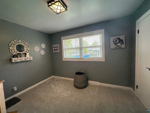 706 28th St, Cloquet, MN 55720 - spare room featuring carpet flooring and baseboards
