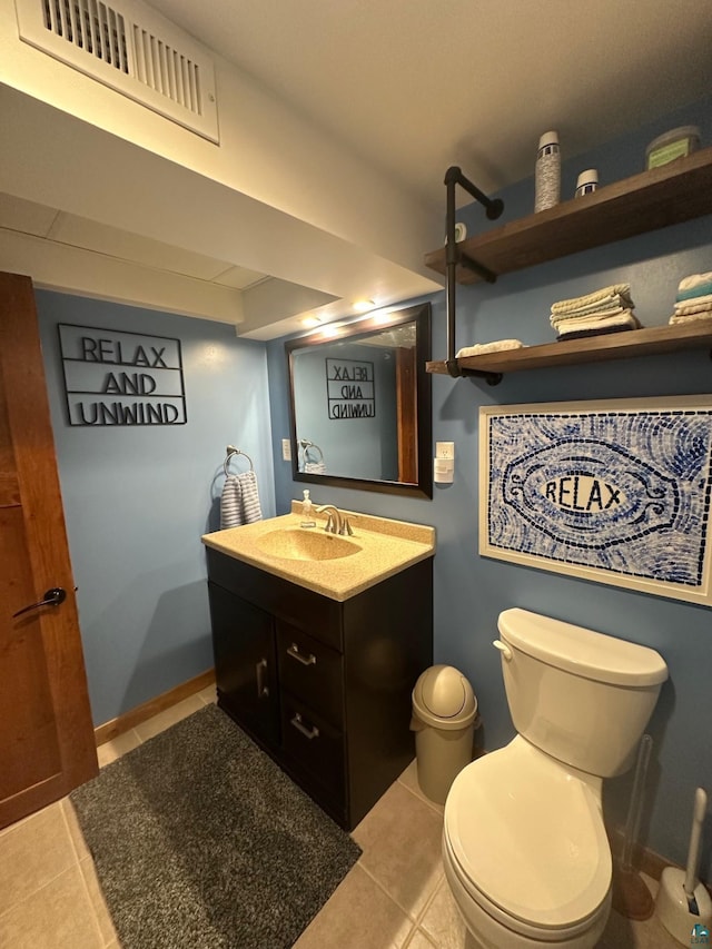706 28th St, Cloquet, MN 55720 - bathroom featuring tile patterned flooring, toilet, and vanity
