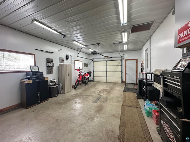 706 28th St, Cloquet, MN 55720 - garage featuring a garage door opener