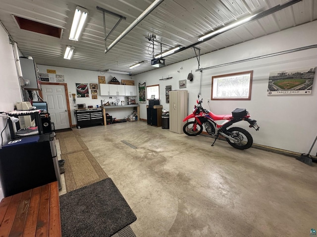 706 28th St, Cloquet, MN 55720 - garage featuring a garage door opener