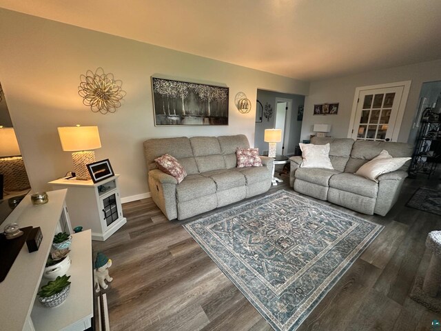706 28th St, Cloquet, MN 55720 - living area featuring dark wood finished floors and baseboards