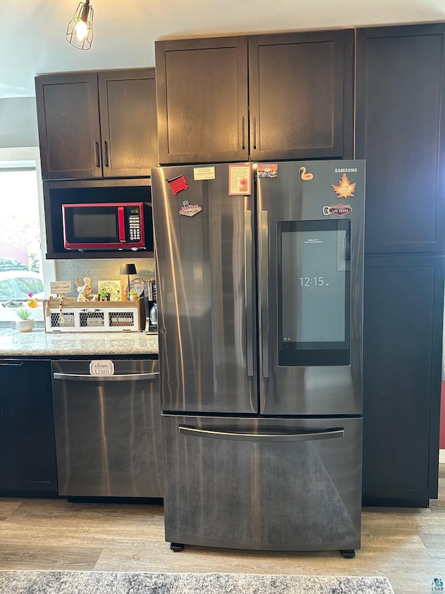 706 28th St, Cloquet, MN 55720 - kitchen with appliances with stainless steel finishes and light wood-type flooring