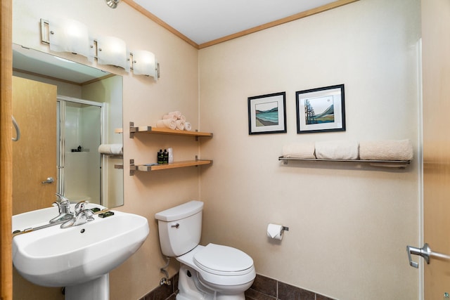 21 E Wisconsin St Unit 301, Grand Marais, MN 55616 - bathroom with a sink, toilet, crown molding, a stall shower, and baseboards