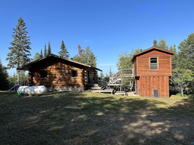 109 Tom Overlook Trl, Hovland, MN 55606 - view of property exterior with a lawn, log siding, a deck, and stairs