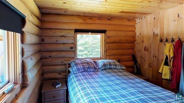 109 Tom Overlook Trl, Hovland, MN 55606 - bedroom with wooden ceiling and log walls