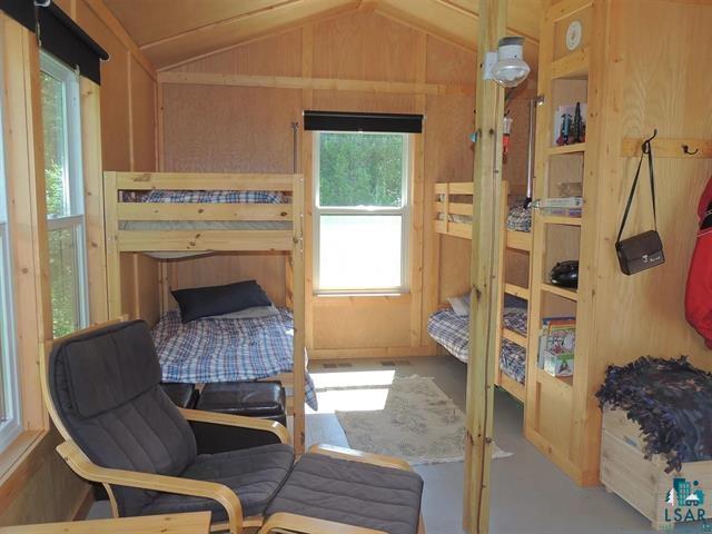 109 Tom Overlook Trl, Hovland, MN 55606 - bedroom featuring vaulted ceiling