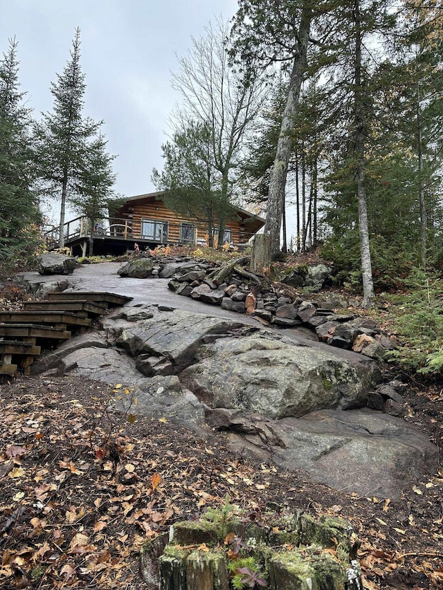 109 Tom Overlook Trl, Hovland, MN 55606 - view of front of home with log exterior and a wooden deck