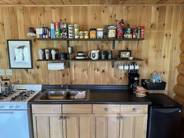 109 Tom Overlook Trl, Hovland, MN 55606 - kitchen with a sink, wood ceiling, white gas range, wooden walls, and dark countertops