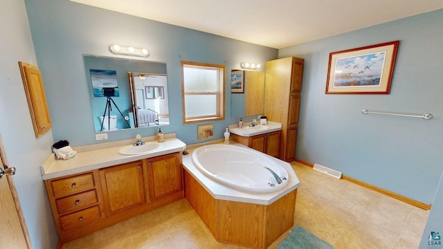 296 Cramer Rd, Schroeder, MN 55613 - ensuite bathroom with two vanities and a garden tub