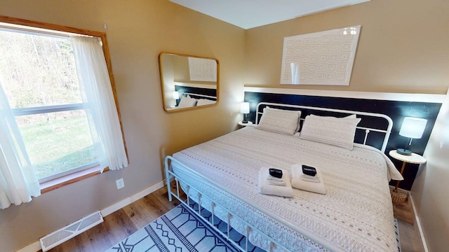 296 Cramer Rd, Schroeder, MN 55613 - bedroom featuring wood finished floors and baseboards