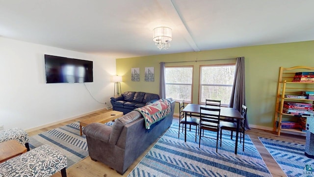 296 Cramer Rd, Schroeder, MN 55613 - living area featuring a chandelier, baseboards, and wood finished floors
