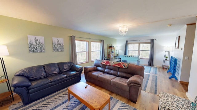 296 Cramer Rd, Schroeder, MN 55613 - living area featuring light wood finished floors, baseboards, and a chandelier