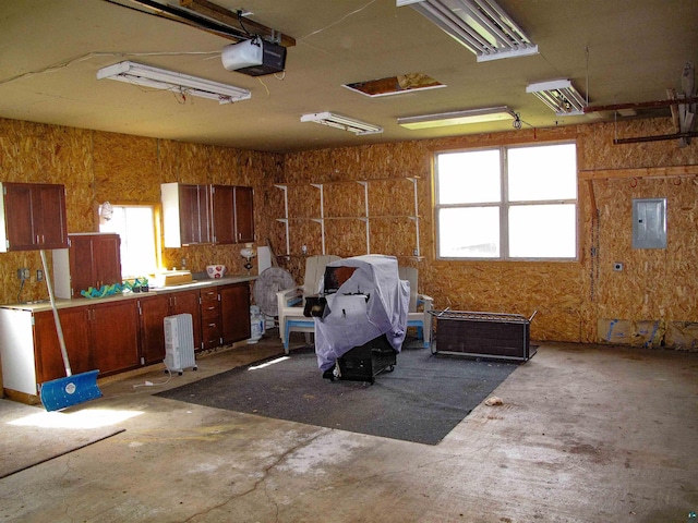 296 Cramer Rd, Schroeder, MN 55613 - garage with electric panel and a garage door opener