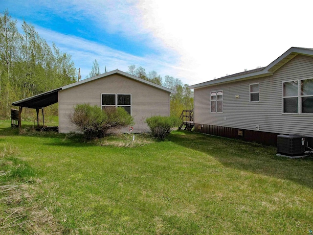 296 Cramer Rd, Schroeder, MN 55613 - view of side of home with central AC unit and a yard
