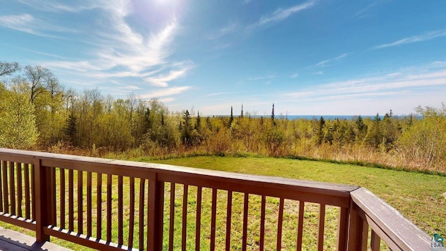 296 Cramer Rd, Schroeder, MN 55613 - wooden deck featuring a lawn
