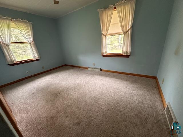 5960 Evergreen Rd, Aurora, MN 55705 - carpeted empty room featuring ceiling fan and baseboards