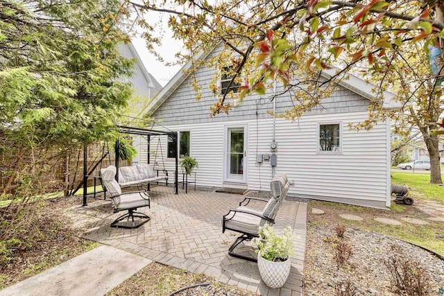 405 10th Ave, Two Harbors, MN 55616 - back of house featuring an outdoor hangout area and a patio area