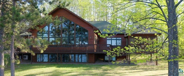1880 S Everett Rd, Tower, MN 55790 - back of property with a lawn and a wooden deck