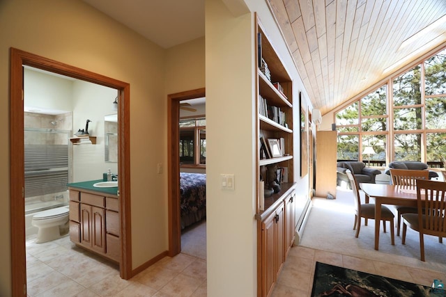 1880 S Everett Rd, Tower, MN 55790 - hallway featuring light tile patterned flooring, light carpet, vaulted ceiling, a sink, and wood ceiling