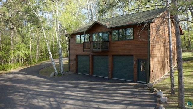 1880 S Everett Rd, Tower, MN 55790 - view of side of property with driveway and an attached garage