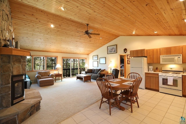 1880 S Everett Rd, Tower, MN 55790 - dining room with light tile patterned floors, wood ceiling, a ceiling fan, light colored carpet, and high vaulted ceiling