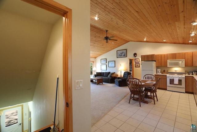1880 S Everett Rd, Tower, MN 55790 - kitchen featuring white appliances, wood ceiling, vaulted ceiling, brown cabinetry, and ceiling fan