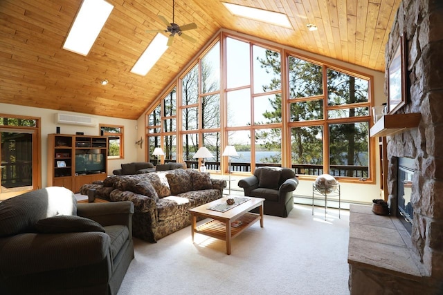 1880 S Everett Rd, Tower, MN 55790 - living area with high vaulted ceiling, a skylight, a wall unit AC, a fireplace, and carpet