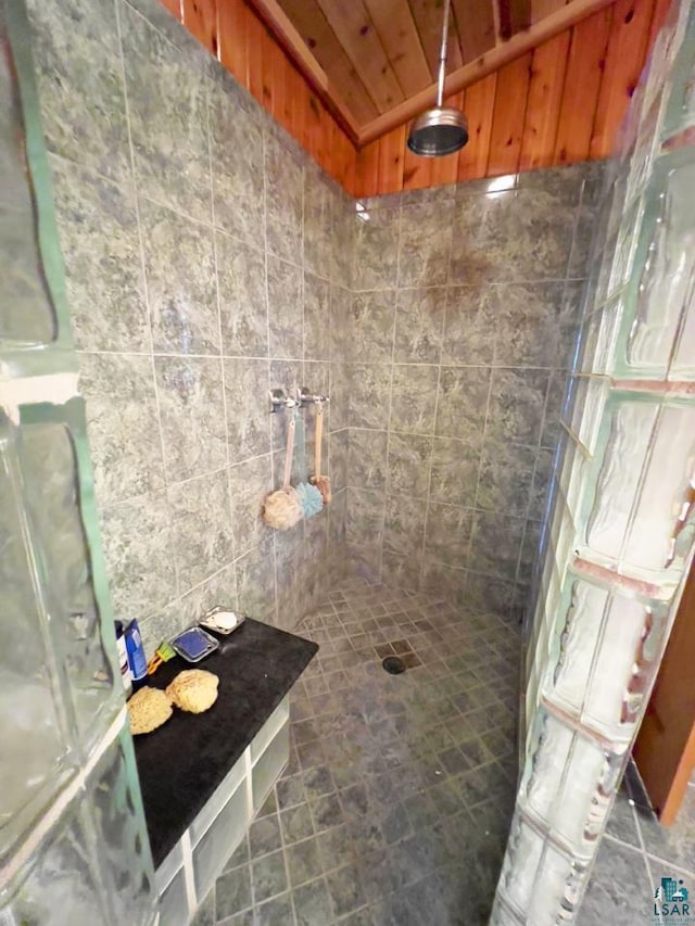 2928 Waters Is, Ely, MN 55731 - bathroom with a tile shower, vaulted ceiling, and wooden ceiling