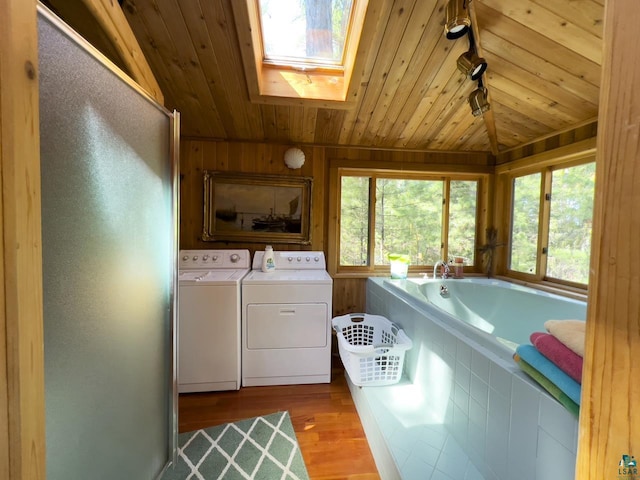 2928 Waters Is, Ely, MN 55731 - laundry area with washer and dryer, wood ceiling, a skylight, wood finished floors, and healthy amount of natural light