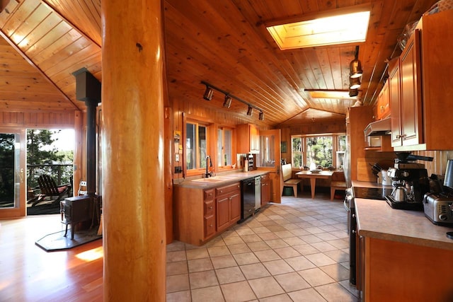 2928 Waters Is, Ely, MN 55731 - kitchen featuring lofted ceiling, wood ceiling, track lighting, a sink, and a skylight
