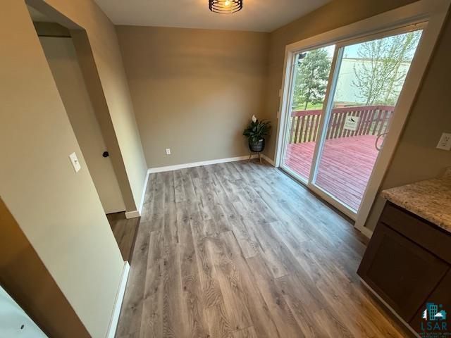 710 N Boundary Ave, Duluth, MN 55810 - unfurnished dining area with wood finished floors and baseboards