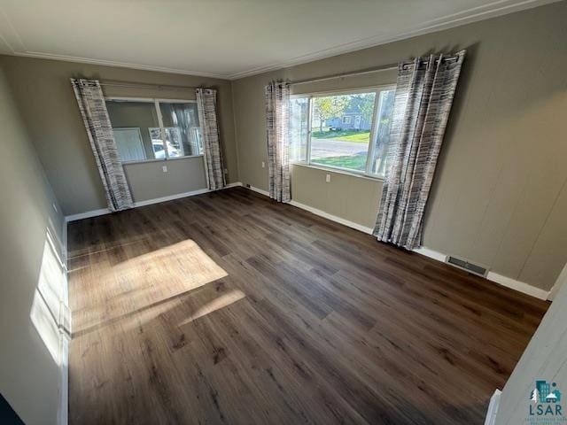 710 N Boundary Ave, Duluth, MN 55810 - empty room featuring ornamental molding, wood finished floors, and baseboards
