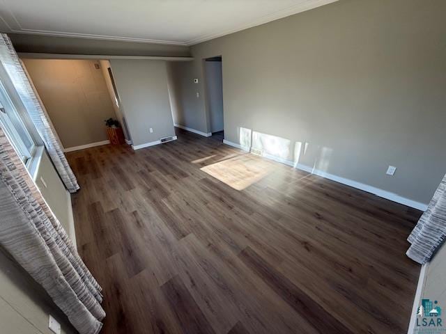 710 N Boundary Ave, Duluth, MN 55810 - unfurnished bedroom with wood finished floors, ornamental molding, and baseboards