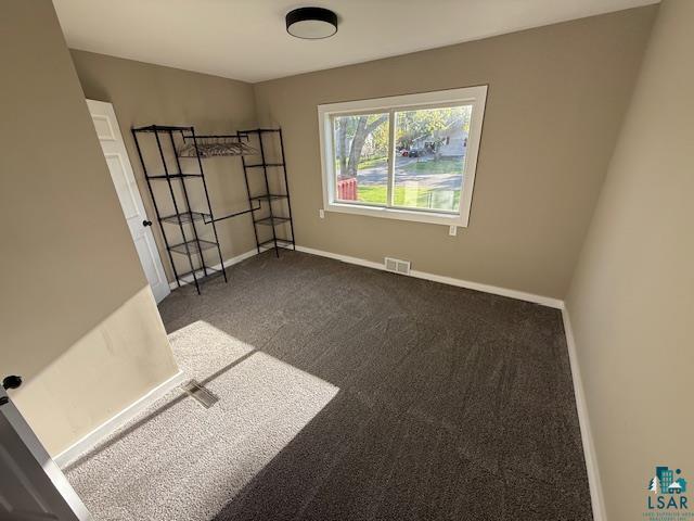 710 N Boundary Ave, Duluth, MN 55810 - carpeted spare room featuring baseboards