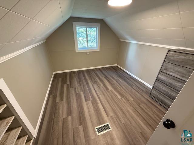 710 N Boundary Ave, Duluth, MN 55810 - additional living space with wood finished floors, baseboards, and vaulted ceiling