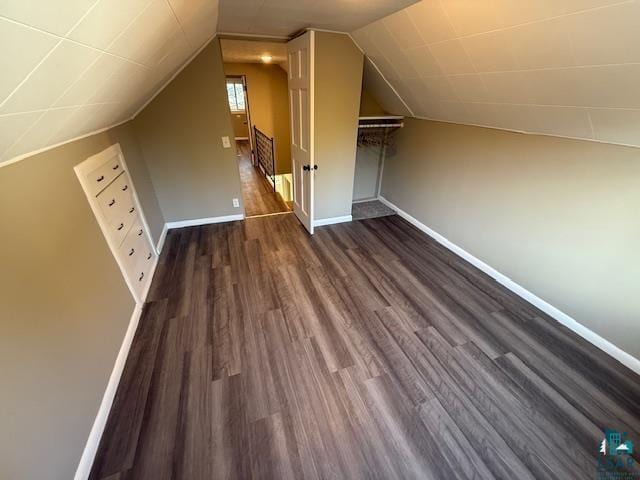 710 N Boundary Ave, Duluth, MN 55810 - additional living space with dark wood-style flooring, baseboards, and vaulted ceiling
